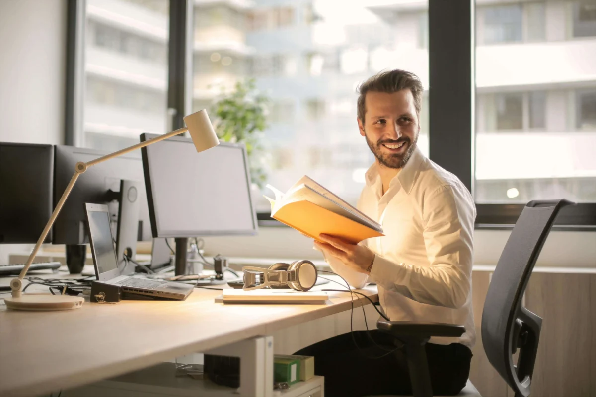 man in office at a desk Furniture Connection office furniture
