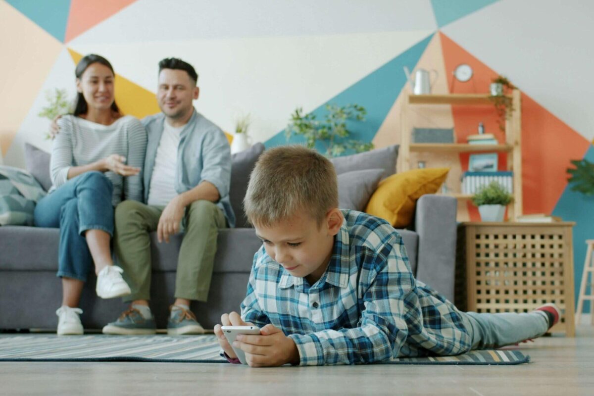 family in living room with couch rent to own furniture Furniture Connection Calgary and Vancouver